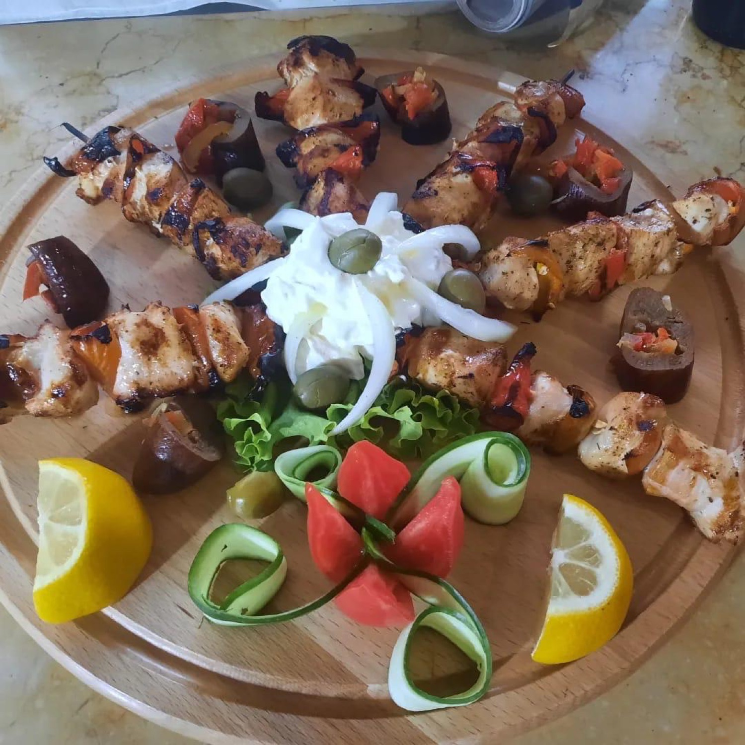 Chicken skewers with peppers on a wooden board